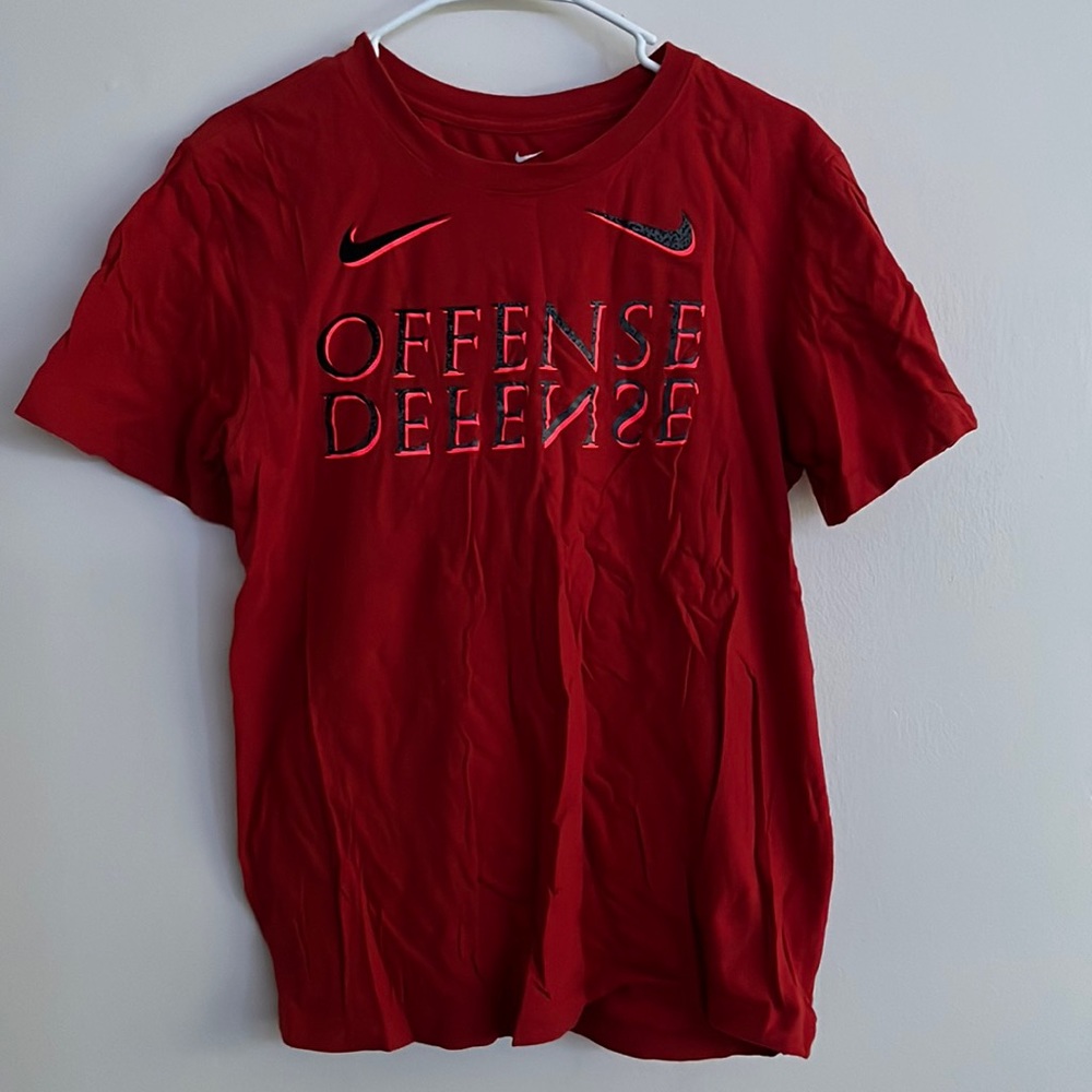 Red Nike Shirt. “Offense. Defense.”